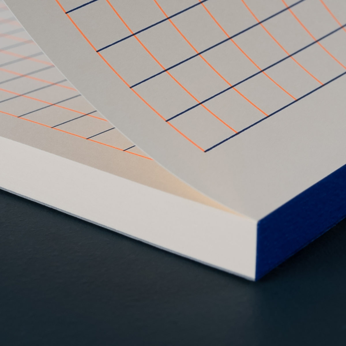 A5 NOTEPAD SQUARED 1 CM orange and reflex blue
